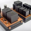 GM70 Integrated Amplifier with copper base, large black transformers, and visible vacuum tubes on a white background, designed for audiophiles. GM70 Integrated Amplifier with copper base, large black transformers, and visible vacuum tubes on a white background, designed for audiophiles.