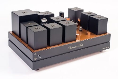 High-end tube amplifier with multiple black transformer covers and a wooden base, featuring The Phono Stage branding and visible tubes.