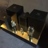 A pair of Vista 3-Way Horn Speakers with metallic gold and black bodies displayed on a gray surface. A pair of Vista 3-Way Horn Speakers with metallic gold and black bodies displayed on a gray surface.