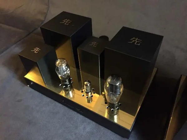 A pair of Vista 3-Way Horn Speakers with metallic gold and black bodies displayed on a gray surface. A pair of Vista 3-Way Horn Speakers with metallic gold and black bodies displayed on a gray surface.